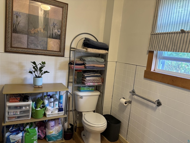 403 E Camp St, Ely, MN 55731 - half bathroom featuring tile walls and a wainscoted wall