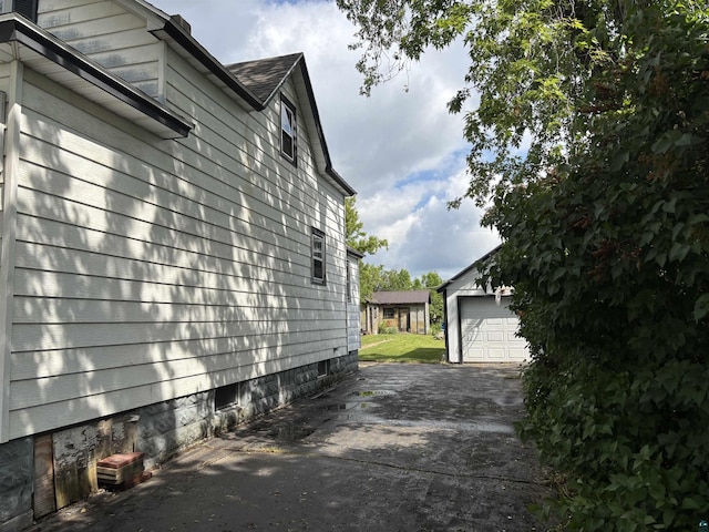 403 E Camp St, Ely, MN 55731 - view of side of home featuring an outdoor structure