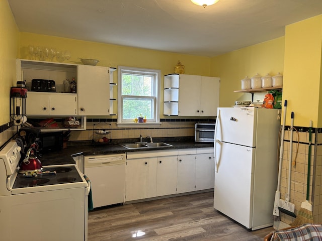 403 E Camp St, Ely, MN 55731 - kitchen featuring white appliances, open shelves, dark countertops, and light wood-style flooring