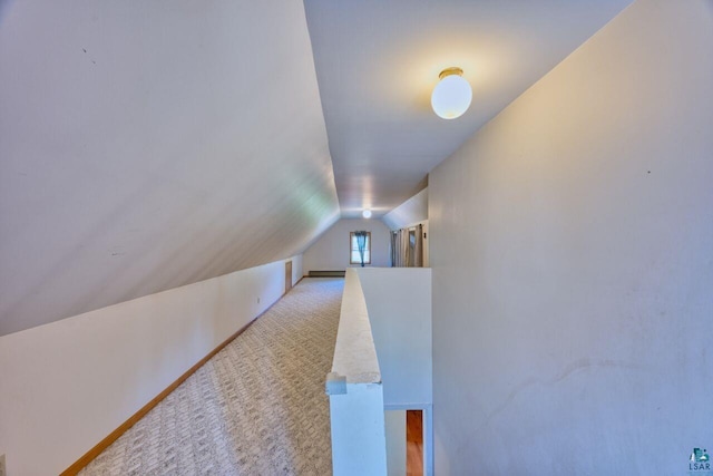 305 W Central Ave, Aurora, MN 55705 - hall featuring vaulted ceiling, carpet floors, and baseboard heating