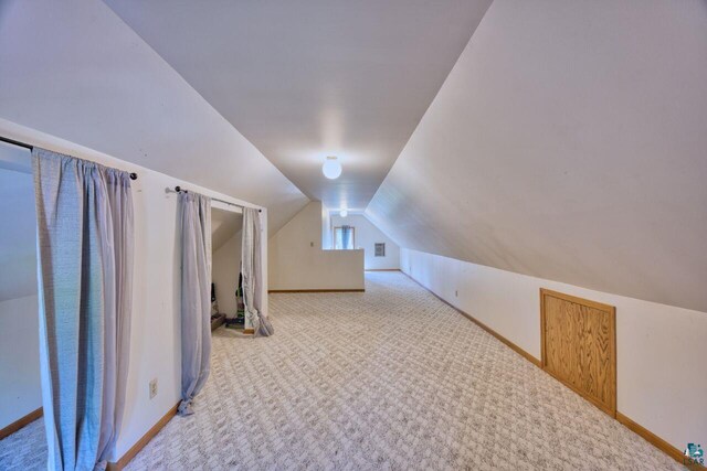 305 W Central Ave, Aurora, MN 55705 - bonus room with vaulted ceiling and carpet flooring