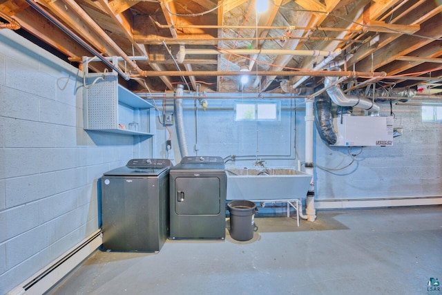 305 W Central Ave, Aurora, MN 55705 - below grade area with a baseboard radiator and separate washer and dryer