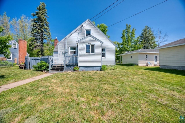 305 W Central Ave, Aurora, MN 55705 - back of property with a wooden deck