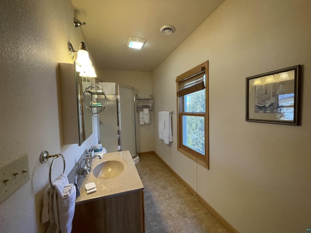 36 N 2nd St Unit 6, Bayfield, WI 54814 - bathroom with vanity, a stall shower, tile patterned floors, and a textured wall