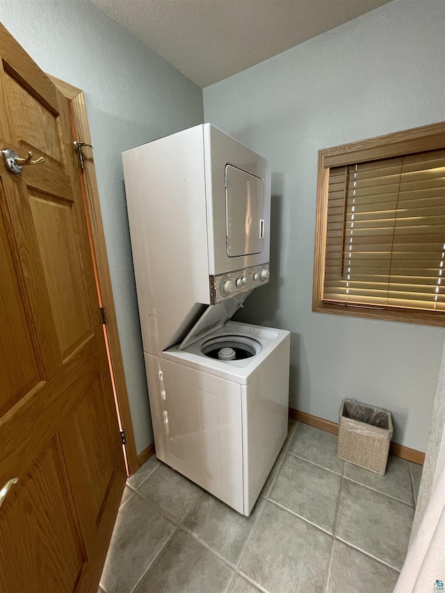 36 N 2nd St Unit 6, Bayfield, WI 54814 - washroom with estacked washer and dryer and light tile patterned flooring