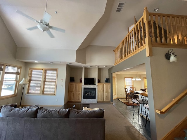 36 N 2nd St Unit 6, Bayfield, WI 54814 - living room with high vaulted ceiling, a ceiling fan, a tile fireplace, and recessed lighting