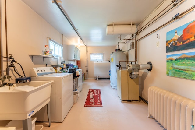 343 E Harvey St, Ely, MN 55731 - laundry room featuring radiator, water heater, and washer and dryer