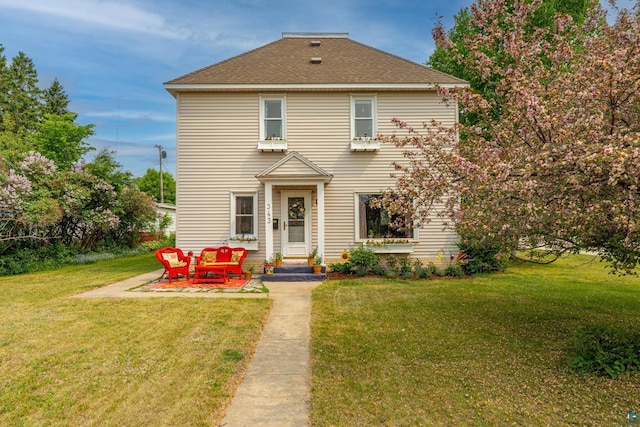 343 E Harvey St, Ely, MN 55731 - view of front of property featuring a front lawn and roof with shingles