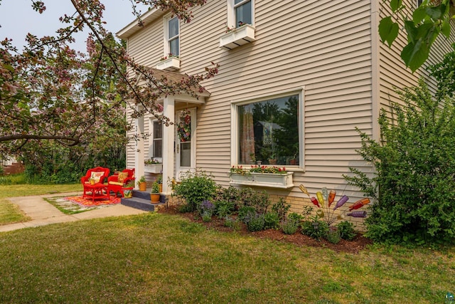 343 E Harvey St, Ely, MN 55731 - view of property exterior featuring a lawn