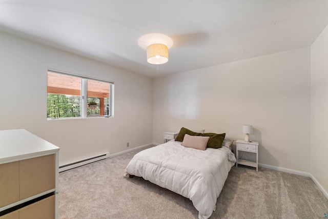 4921 W Pioneer Rd, Duluth, MN 55803 - carpeted bedroom featuring a baseboard heating unit and baseboards