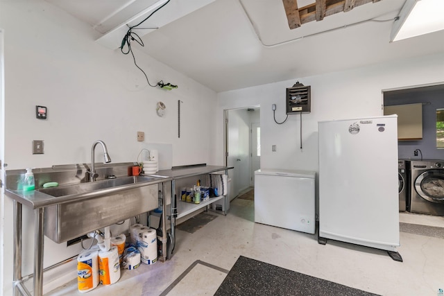 4921 W Pioneer Rd, Duluth, MN 55803 - kitchen featuring freestanding refrigerator, fridge, washing machine and clothes dryer, and concrete flooring