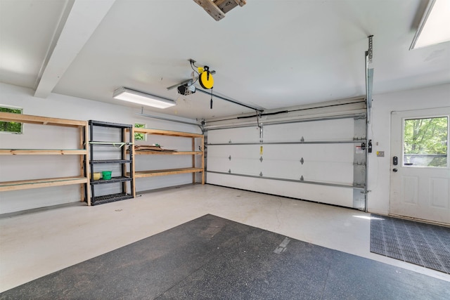 4921 W Pioneer Rd, Duluth, MN 55803 - garage featuring a garage door opener