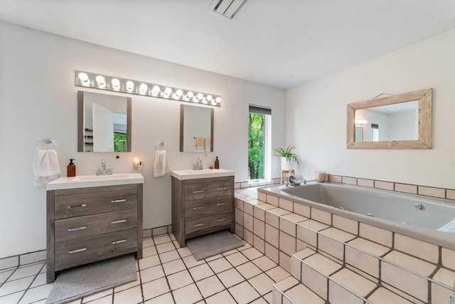 4921 W Pioneer Rd, Duluth, MN 55803 - bathroom with two vanities, a jetted tub, and tile patterned flooring
