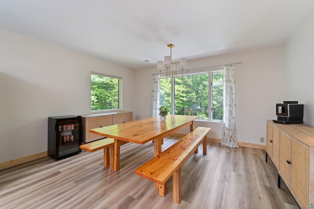 4921 W Pioneer Rd, Duluth, MN 55803 - dining room featuring light wood finished floors and a chandelier