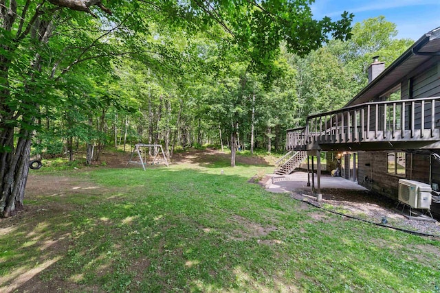 4921 W Pioneer Rd, Duluth, MN 55803 - view of green lawn featuring stairs, a patio area, and a wooden deck