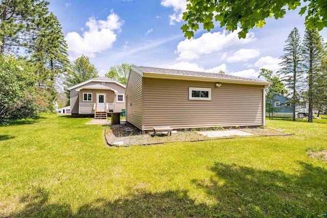 1707 Swan Lake Rd, Duluth, MN 55811 - rear view of house featuring a lawn