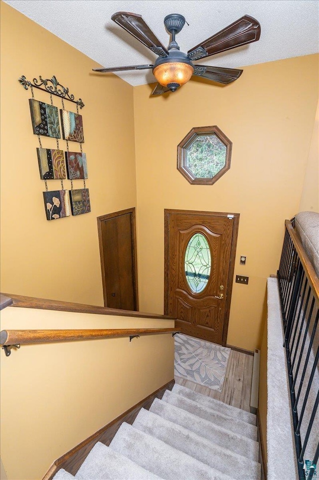 1819 Yosemite Ave, Duluth, MN 55811 - foyer entrance with ceiling fan and stairway