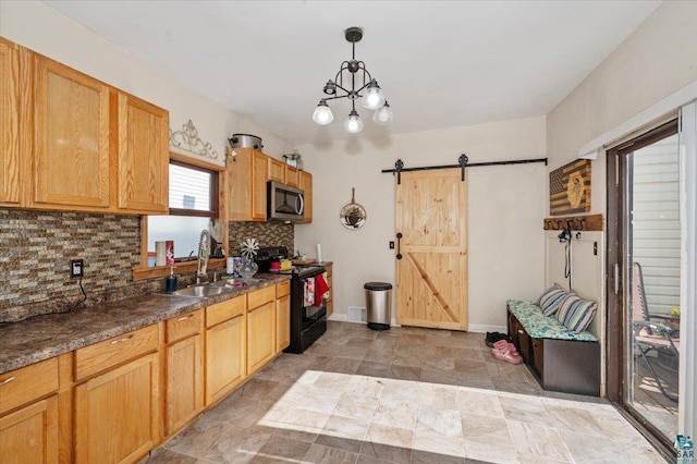 2973 Devonshire St, Duluth, MN 55806 - kitchen with black range with electric cooktop, stainless steel microwave, a barn door, decorative backsplash, and dark countertops