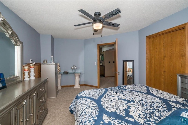 140 E Harney Rd, Esko, MN 55733 - bedroom with light colored carpet, ceiling fan, and a textured ceiling