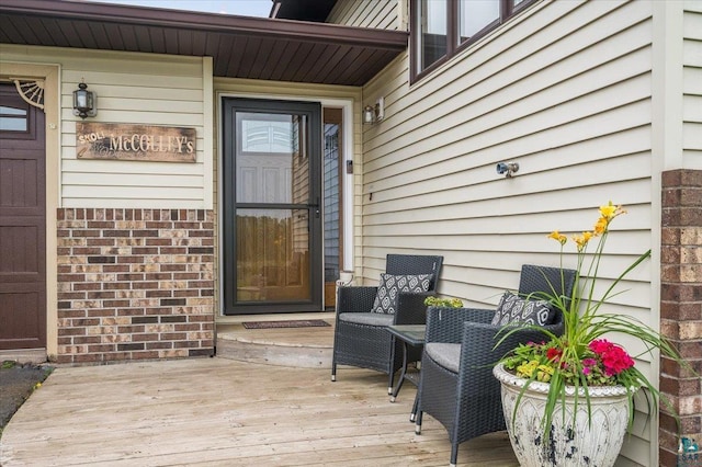 140 E Harney Rd, Esko, MN 55733 - property entrance with a deck and brick siding