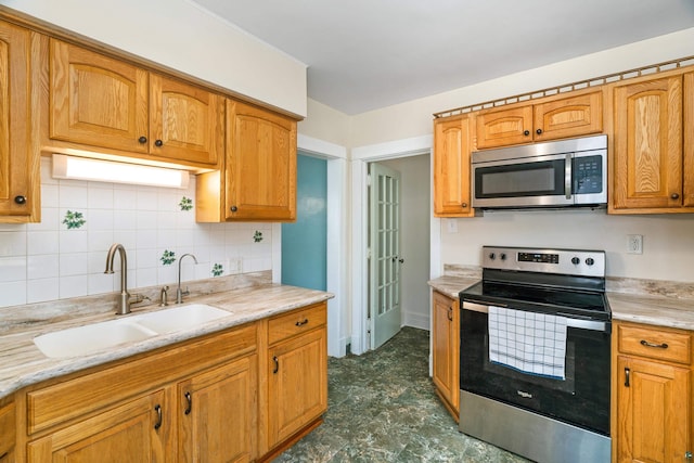 7 Marine Ct, Duluth, MN 55808 - kitchen featuring appliances with stainless steel finishes, decorative backsplash, and brown cabinets