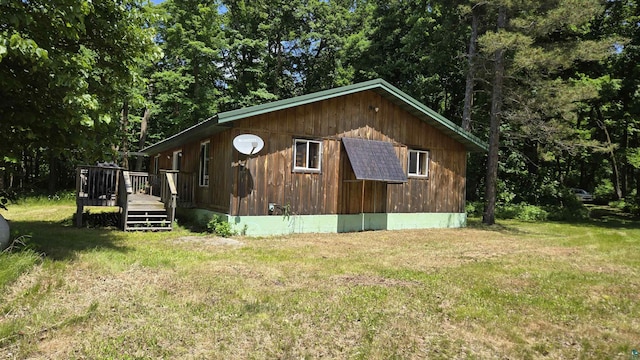 XX3 Sugar Bush Trl, Orr, MN 55771 - view of property exterior with a lawn and a deck