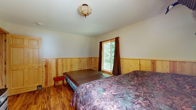XX3 Sugar Bush Trl, Orr, MN 55771 - bedroom with a wainscoted wall, wood walls, and wood finished floors