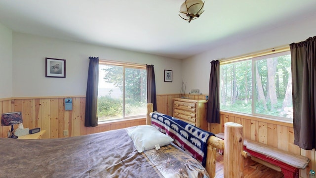 XX3 Sugar Bush Trl, Orr, MN 55771 - bedroom featuring wood walls and wainscoting