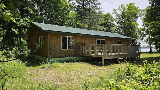 XX3 Sugar Bush Trl, Orr, MN 55771 - view of front of house with a deck and a metal roof