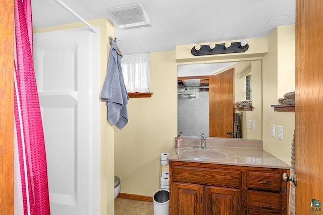 2025 E 8th St, Duluth, MN 55812 - full bathroom with a shower with curtain, vanity, and tile patterned flooring
