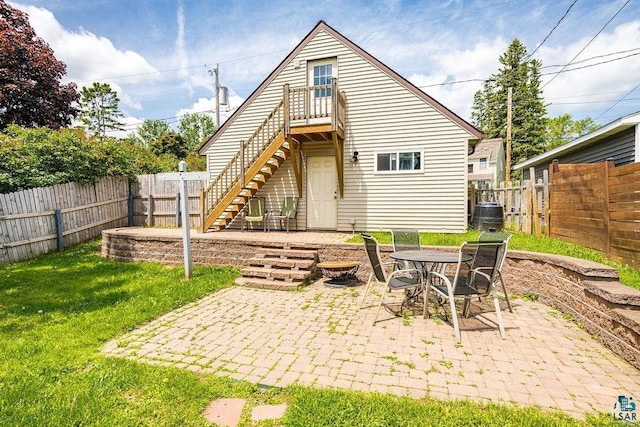 2025 E 8th St, Duluth, MN 55812 - rear view of property featuring stairs, a fenced backyard, and a patio area