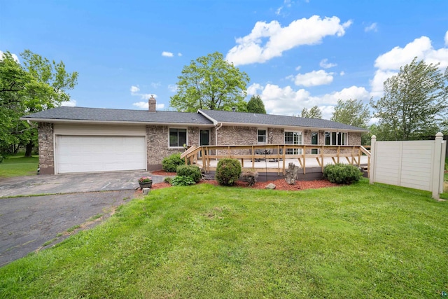 5510 Thompson Hill Rd, Duluth, MN 55810 - ranch-style house featuring asphalt driveway, a garage, brick siding, a chimney, and a wooden deck