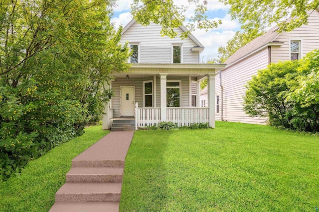 2626 W 5th St, Duluth, MN 55806 - view of front of house featuring a porch and a front lawn