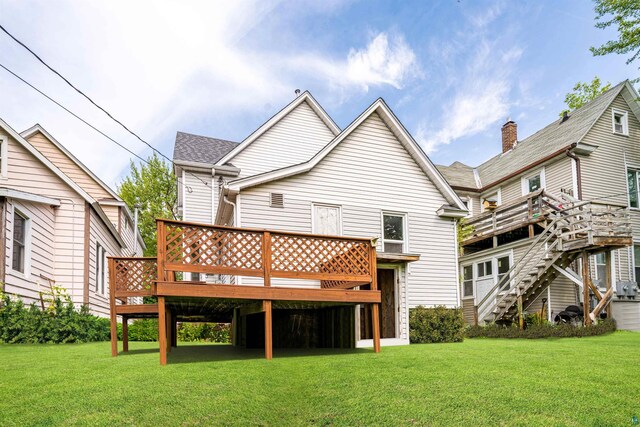 2626 W 5th St, Duluth, MN 55806 - rear view of property featuring a deck and a lawn