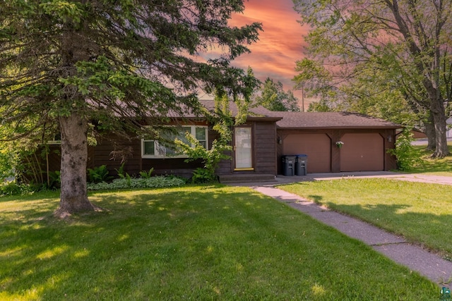 6122 Tacony St, Duluth, MN 55807 - view of front of property featuring a garage, a front lawn, and driveway