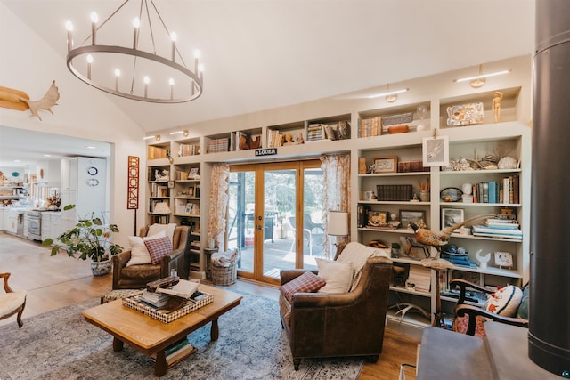27 Ryan Ln, Esko, MN 55733 - living room featuring high vaulted ceiling, wood finished floors, and a chandelier