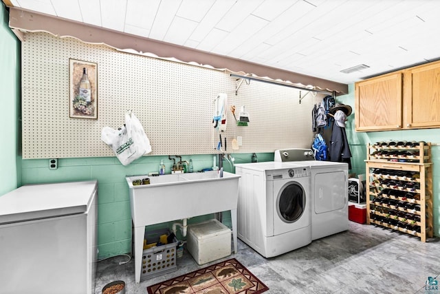 4750 Morris Thomas Rd, Hermantown, MN 55811 - laundry area featuring washer and dryer and cabinet space