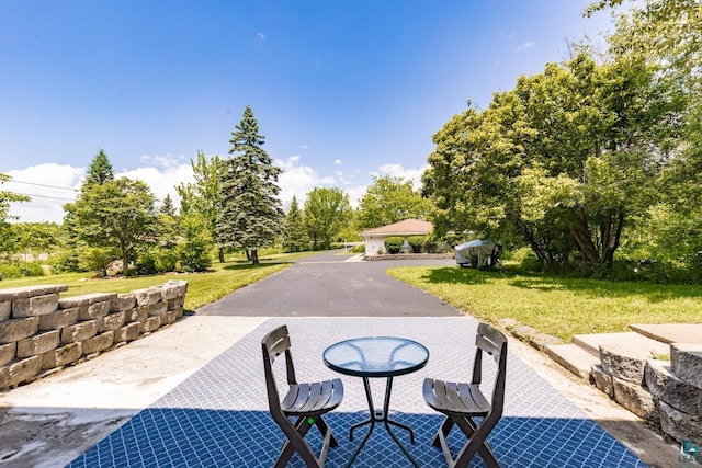 4750 Morris Thomas Rd, Hermantown, MN 55811 - view of patio featuring view of scattered trees