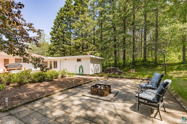 4750 Morris Thomas Rd, Hermantown, MN 55811 - view of patio / terrace with an outdoor fire pit