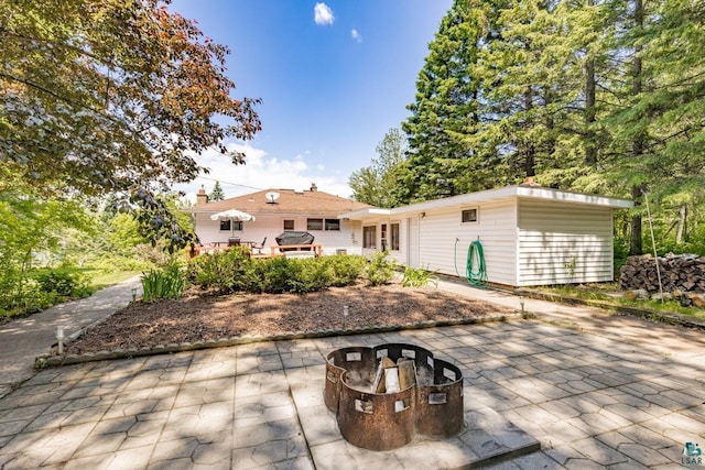 4750 Morris Thomas Rd, Hermantown, MN 55811 - view of patio with a fire pit