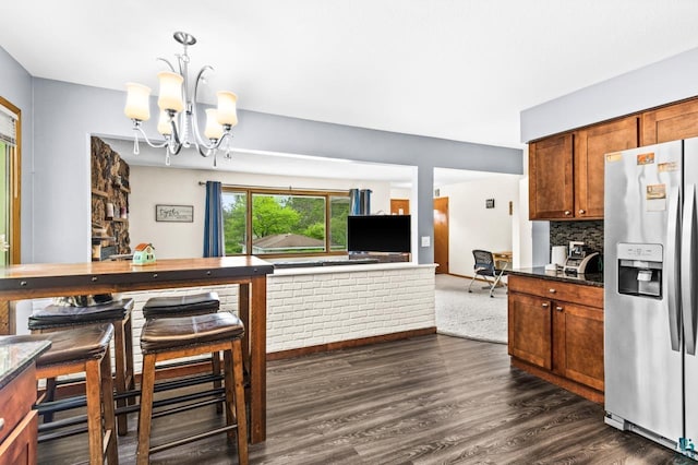 4750 Morris Thomas Rd, Hermantown, MN 55811 - kitchen with stainless steel refrigerator with ice dispenser, dark wood finished floors, a chandelier, brown cabinets, and open floor plan