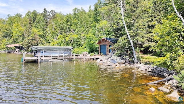 2357 Retreat Lodge Rd, Cook, MN 55723 - dock area featuring boat lift, a water view, and a forest view