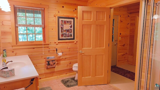 2357 Retreat Lodge Rd, Cook, MN 55723 - bathroom featuring vanity, wood walls, tile patterned flooring, and a shower with door