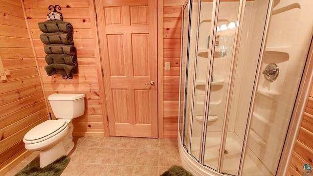 2357 Retreat Lodge Rd, Cook, MN 55723 - bathroom with a shower stall, wood walls, and tile patterned flooring