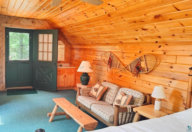 2357 Retreat Lodge Rd, Cook, MN 55723 - carpeted living room with lofted ceiling, wooden ceiling, and wooden walls