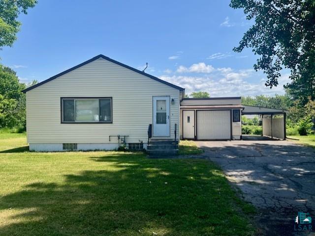 612 23rd St, Cloquet, MN 55720 - view of front of home with asphalt driveway, an attached garage, a front yard, and entry steps