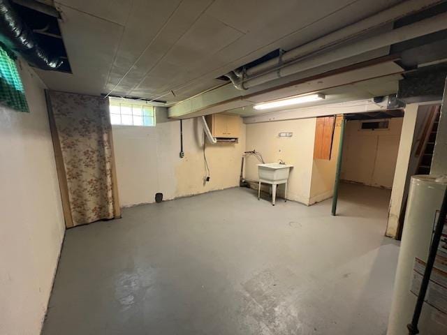 612 23rd St, Cloquet, MN 55720 - basement with gas water heater and a sink