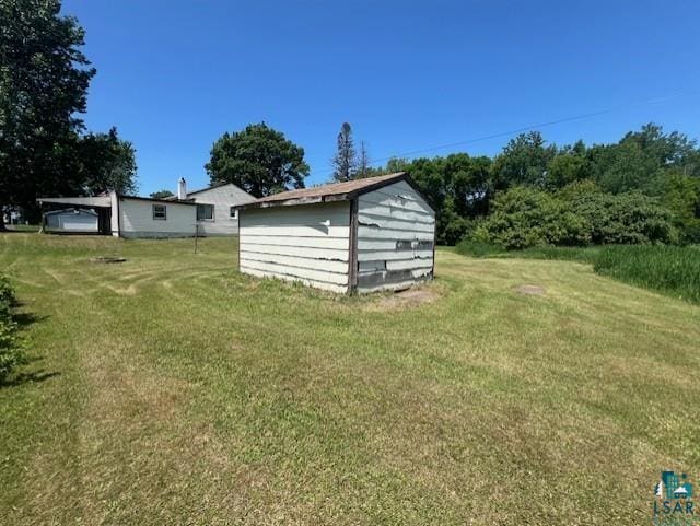 612 23rd St, Cloquet, MN 55720 - view of grassy yard featuring a storage shed