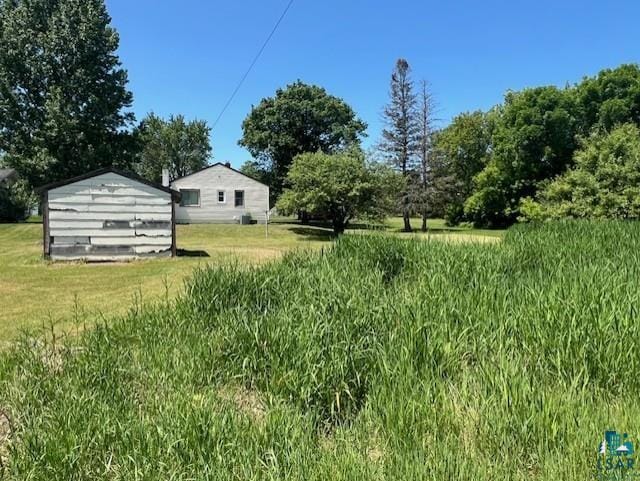 612 23rd St, Cloquet, MN 55720 - view of yard featuring a storage shed