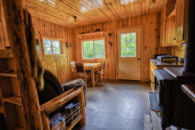 4194 First Lake Rd, Ely, MN 55731 - dining area with wood walls, concrete flooring, and wooden ceiling